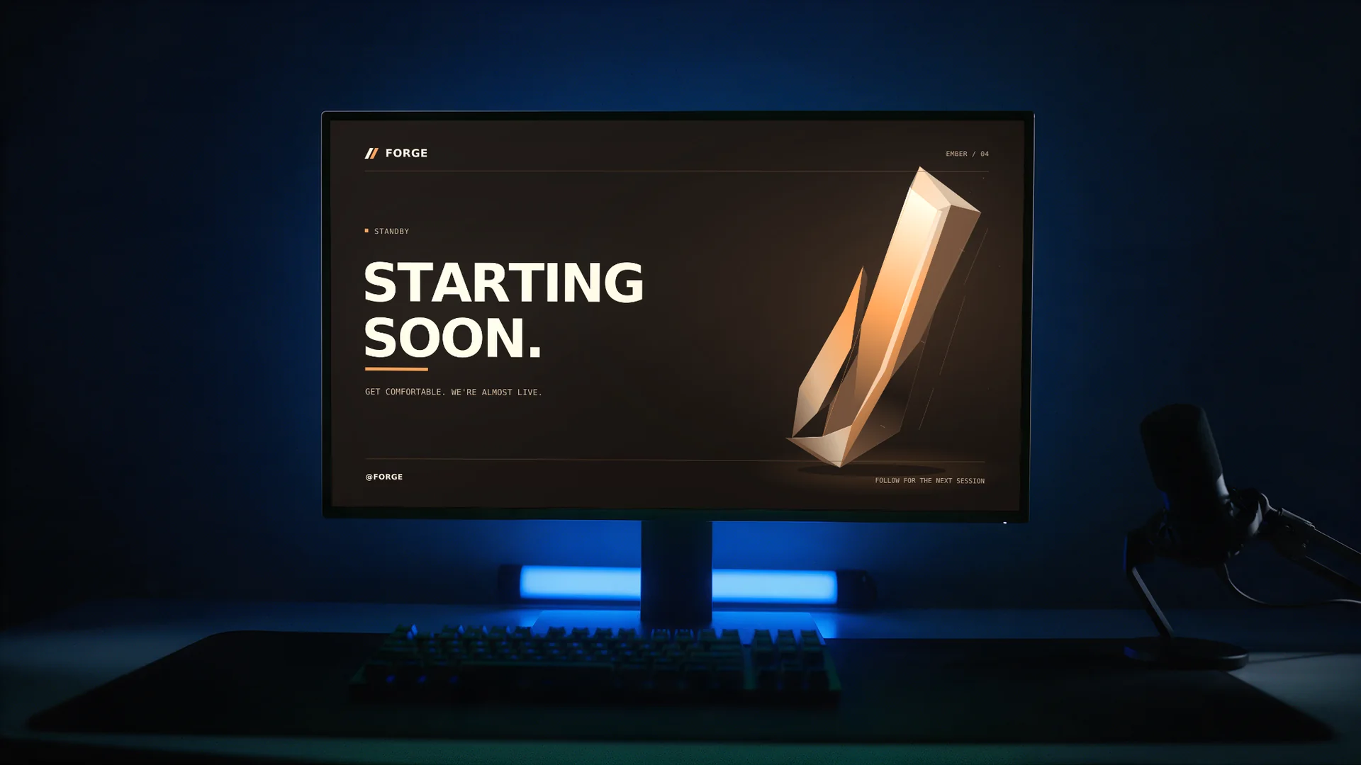 Ember scene personalized as FORGE on a desk monitor