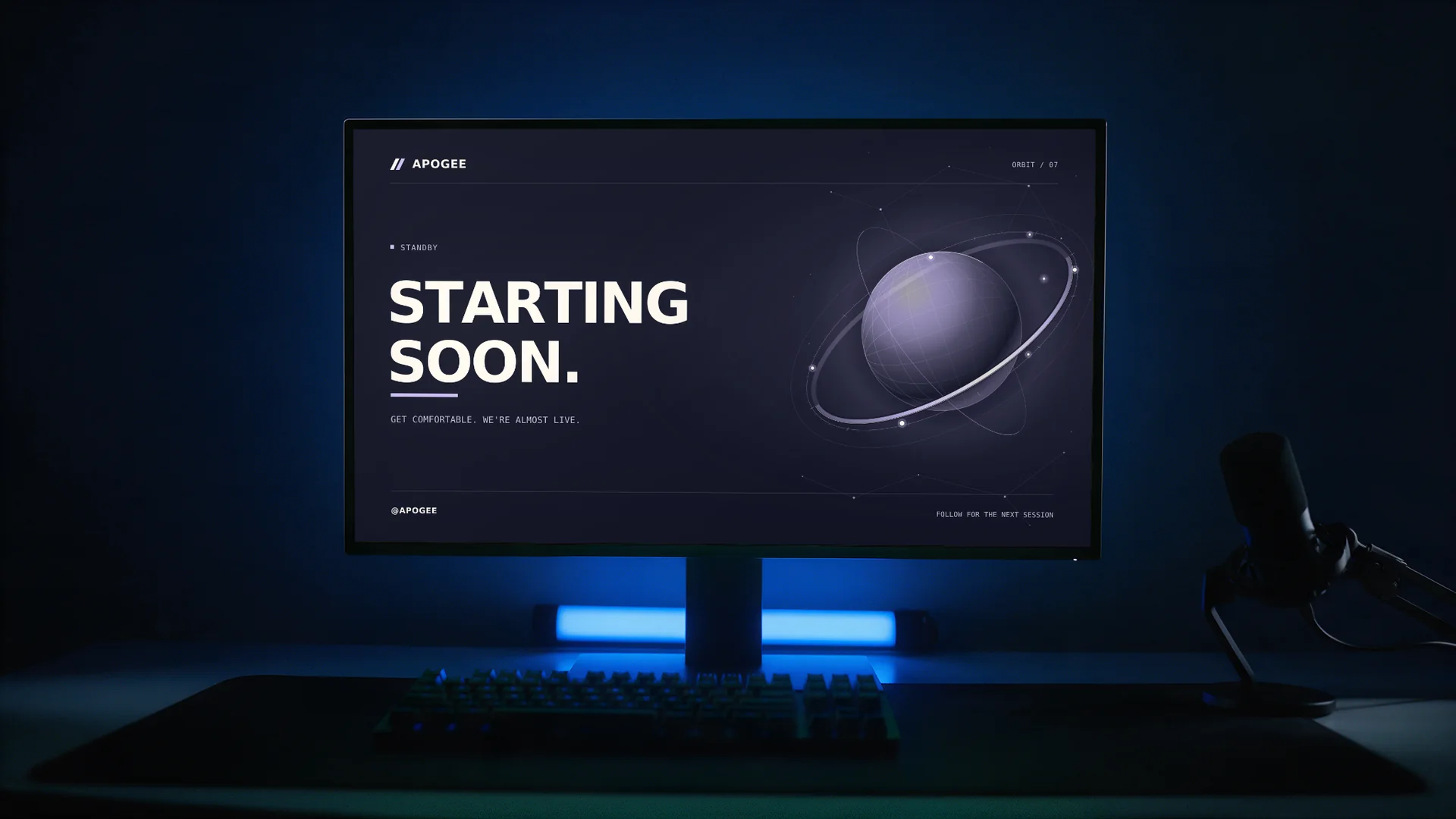 Orbit scene personalized as APOGEE on a desk monitor